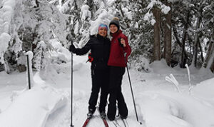 Patricia Fillmore (Translating & Copywriting) cross country skiing with another woman